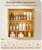 A multi-shelf bamboo cabinet filled with various bathroom products and toiletries, with icons and text at the bottom suggesting product categories. Voir les images du produit