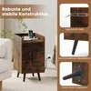 A narrow bedside table with a charging station, drawers, and metal legs, shown in a room setting with a couch and a plant. Podgląd zdjęcia produktu