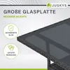 Close-up of a black rattan garden table with a glass top, featuring marketing text and icons. Produktbild-Vorschau