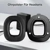 A close-up shot of replacement ear pads and a mounting frame for headphones, placed on a desk. Produktbild-Vorschau