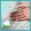 A hand is gently touching a soft diaper, with a cotton icon in the corner. Podgląd zdjęcia produktu