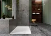 A modern bathroom with a shower area, bathtub, shelving unit, and stool. Produktbild-Vorschau