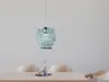 A chandelier hanging above a table. Produktbild-Vorschau