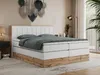A bedroom scene featuring a large boxspring bed. Produktbild-Vorschau