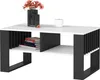 A modern coffee table with a white top and black frame, decorated with a vase of flowers and a candle. Produktbild-Vorschau