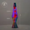 A lava lamp with colorful, flowing wax is shown against a dark background. Text labels and a height measurement are overlaid on the image. Podgląd zdjęcia produktu