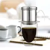 A Vietnamese coffee filter set over a glass cup filled with coffee. Produktbild-Vorschau