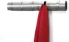 A silver wall-mounted coat rack with a red scarf hanging from one of the hooks. Podgląd zdjęcia produktu