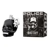 A black skull-shaped perfume bottle and its packaging are displayed against a white background. Náhľad obrázku produktu