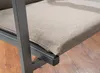 A close-up view of a chair cushion on a wooden floor. Produktbild-Vorschau
