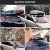 A collage of four images showing different types of car roof rack accessories: a kayak, a roof cargo box, a bike carrier, and a cargo basket. Produktbild-Vorschau