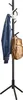 A black coat rack with a jacket, a backpack, and headphones hanging on it. Podgląd zdjęcia produktu
