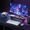 A gaming setup with a monitor, keyboard, mouse, and controllers. Produktbild-Vorschau