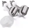A set of toilet seat hinges and a small white plastic piece on a white background. Podgląd zdjęcia produktu