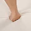A hand is pressing into a soft, beige surface, likely demonstrating the material's cushioning or flexibility. Voir les images du produit