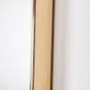 A close-up view of the edge of a mirror frame. Produktbild-Vorschau