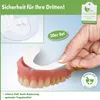 A hand is shown applying a denture liner to a set of dentures. Produktbild-Vorschau