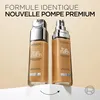 Two bottles of L'Oréal Paris True Match foundation are displayed on a white surface against a light beige background. An arrow indicates a rotation or change. Voir les images du produit