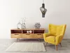 A modern living room scene with a yellow armchair, a wooden media console, and a pendant light. Produktbild-Vorschau