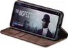 A smartphone in a brown flip case is displayed, showing a movie poster on its screen. Produktbild-Vorschau
