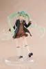A figurine of Hatsune Miku in a school uniform, standing on a clear display base. Podgląd zdjęcia produktu