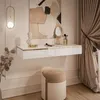 A modern vanity set with a floating console, stool, and artwork. Náhled obrázku produktu