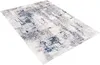 A rectangular rug with an abstract pattern in cream, gray, and blue tones, shown from a slightly elevated angle on a white background. Náhled obrázku produktu