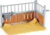 A toy horse stable with hay on the ground. Anteprima dell’immagine prodotto