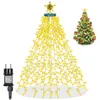 A string of yellow LED lights shaped like a Christmas tree, with a star on top, and a power adapter on the side. A decorated Christmas tree is shown in the background. Produktbild-Vorschau