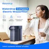 A woman in a bathrobe drinks water next to a Waterdrop electric water filter. Podgląd zdjęcia produktu
