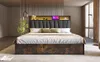 A bedroom scene featuring a bed with LED lighting and a headboard with storage. Voir les images du produit