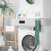 A laundry room scene with a washing machine, dryer, and shelving unit. Podgląd zdjęcia produktu