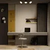 A modern home office or study area with a desk, chair, laptop, and decorative items. Produktbild-Vorschau