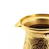 A close-up shot of the top part of a golden coffee pot with intricate carvings. Produktbild-Vorschau
