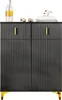 A black cabinet with gold handles and gold legs, displayed against a white background. Decorative items are placed on top of the cabinet. Anteprima dell’immagine prodotto
