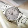A close-up shot of a silver Seiko watch with a white dial. Náhľad obrázku produktu