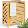 A wooden laundry basket with a towel hanging on the side, set against a white background with some green grass in the foreground. Produktbild-Vorschau