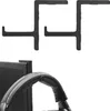 Two black headset holders are shown against a white background, with a close-up of a headset resting on one of them. Produktbild-Vorschau
