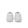 A pair of white New Balance sneakers shown from the back. Podgląd zdjęcia produktu