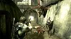 Two characters are in combat with creatures in a gritty, urban environment. Podgląd zdjęcia produktu