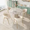A dining set with a marble-top table and four upholstered chairs in a modern dining room. Náhled obrázku produktu