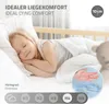 A young child sleeping peacefully on a mattress, with marketing text and graphics overlayed. Produktbild-Vorschau