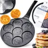 A close-up shot of a Vilde egg frying pan with animal-shaped molds, featuring two finished pancakes and a stack of pancakes with blueberries in the foreground. Anteprima dell’immagine prodotto