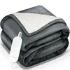 A folded dark gray electric heated blanket with a white sherpa lining, shown with its white controller and cord. Náhľad obrázku produktu