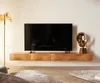 A modern living room with a wall-mounted TV and a wooden media console. Produktbild-Vorschau