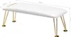 A white manicure cushion with gold hairpin legs, shown from a diagonal angle. Anteprima dell’immagine prodotto