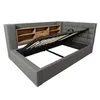 A grey upholstered bed frame with an open storage compartment and a wooden headboard with shelves. Produktbild-Vorschau