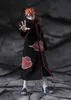 A full-body shot of an action figure of the character Pain Tendo from Naruto Shippuden, standing on a textured gray surface against a dark gray background. Náhled obrázku produktu