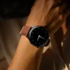 A close-up shot of a person's wrist wearing a smartwatch. Podgląd zdjęcia produktu