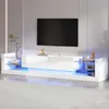 A modern white TV stand with LED lighting in a living room setting. Produktbild-Vorschau